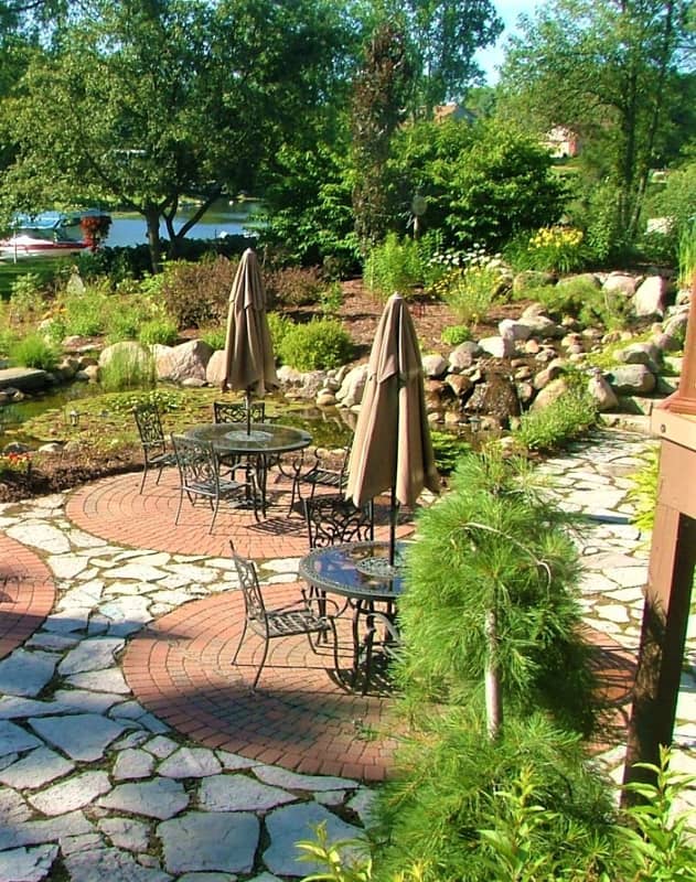landscaped patio with two tables
